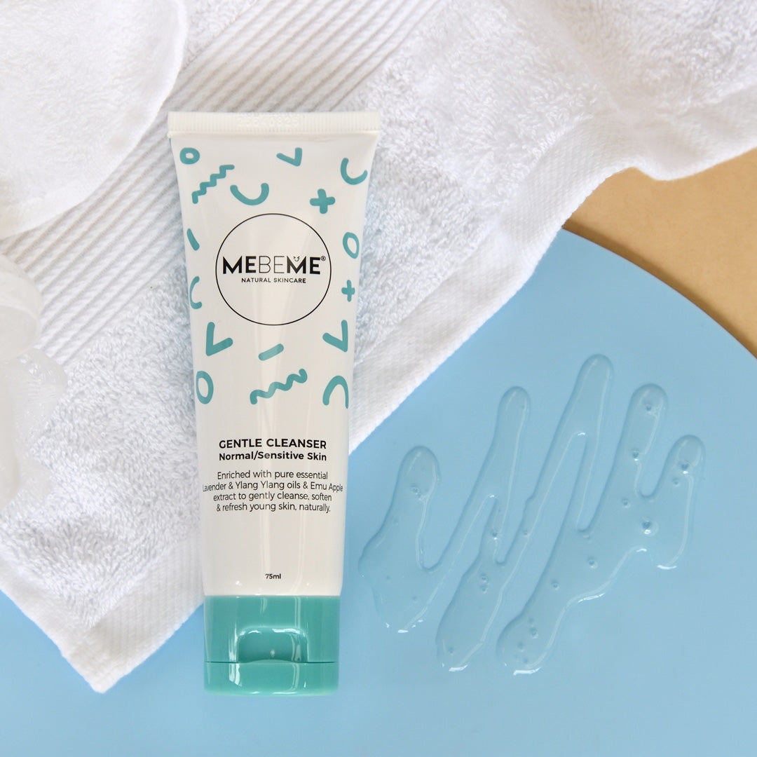 Tube of MEBEME Gentle Cleanser on a blue surface with a white towel