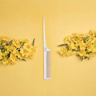 hair-comb-with-flowers-on-yellow-background