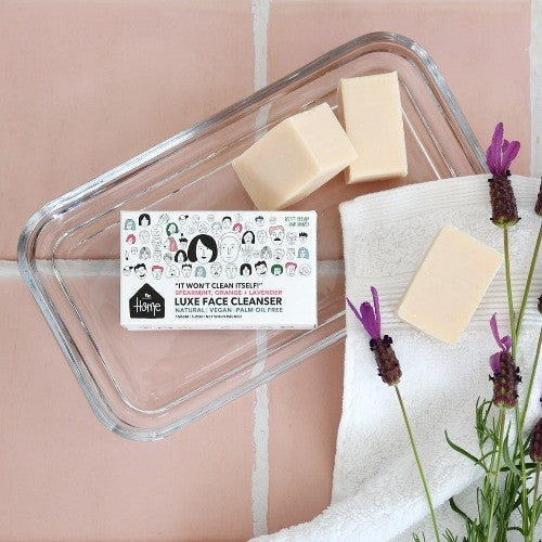 Cleanser-soap-bar-clear-dish-pink-tile-background