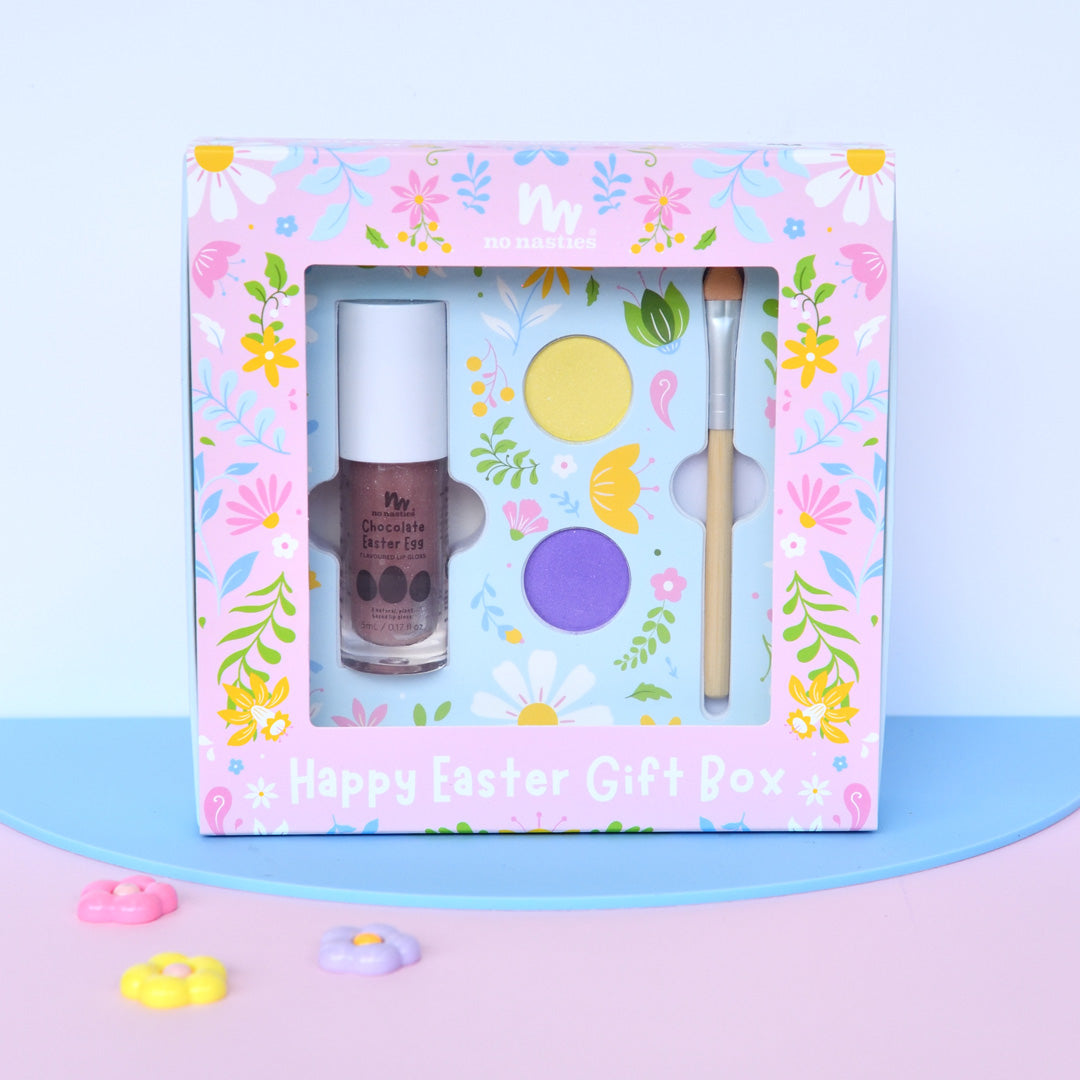 Happy Easter gift box with nail polish and other items on a colorful background