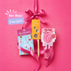 A hair magic gift set on a bright pink background, featuring a pink ribbon bow, a package of Christmas nail sticker sheets, a comb, and a pink hair styling tool. Text overlay reads 'Hair Magic Free Gift' on a bright pink background