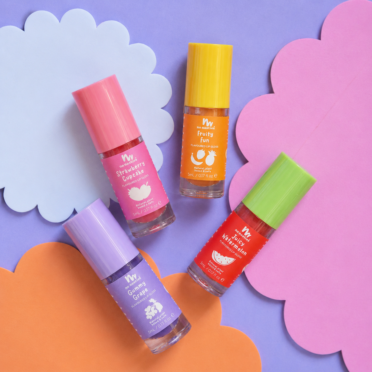 Four small cosmetic bottles with colorful caps and labels arranged on pastel paper clouds. The labels read Mr.