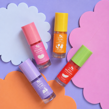 Four small cosmetic bottles with colorful caps and labels arranged on pastel paper clouds. The labels read Mr.