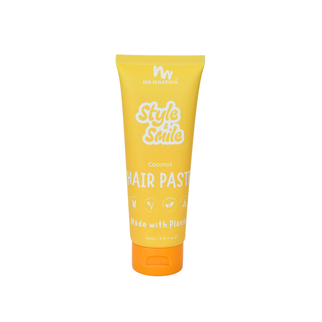 Yellow tube of hair paste with orange cap on a white background