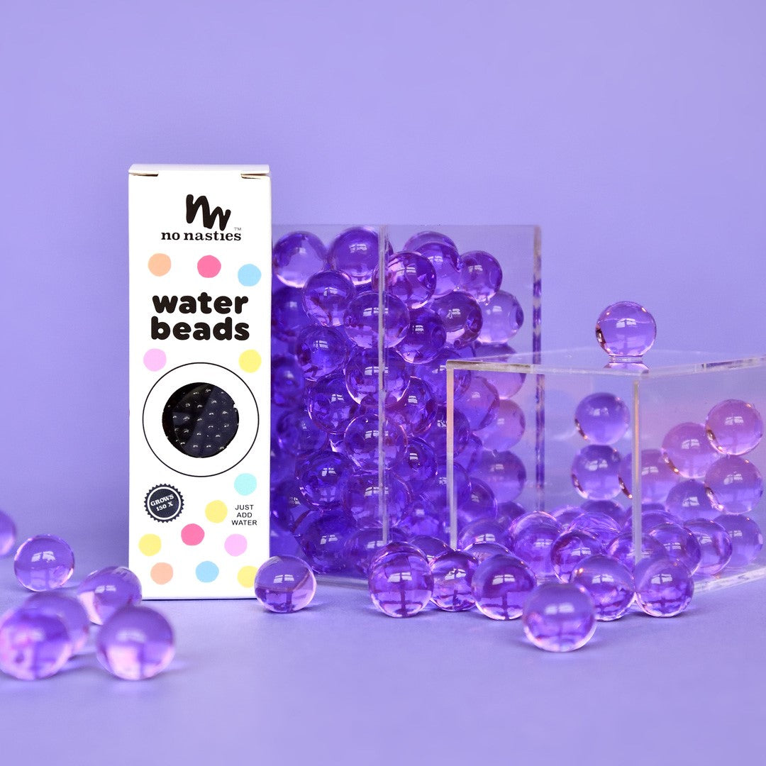 Purple water beads with a 'no nasties' packaging on a purple background