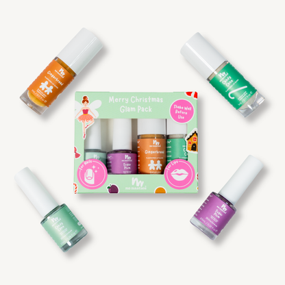 A nail polish gift set labeled 'Merry Christmas Glam Pack' with four bottles arranged around a light green illustrated box on a plain light background. The bottles contain orange, mint green, purple, and dark green polishes, and the packaging features festive graphics and pink circular callouts.