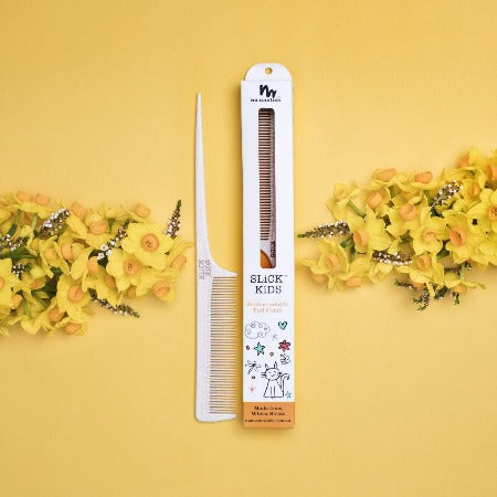 hair-comb-with-flowers-on-yellow-background
