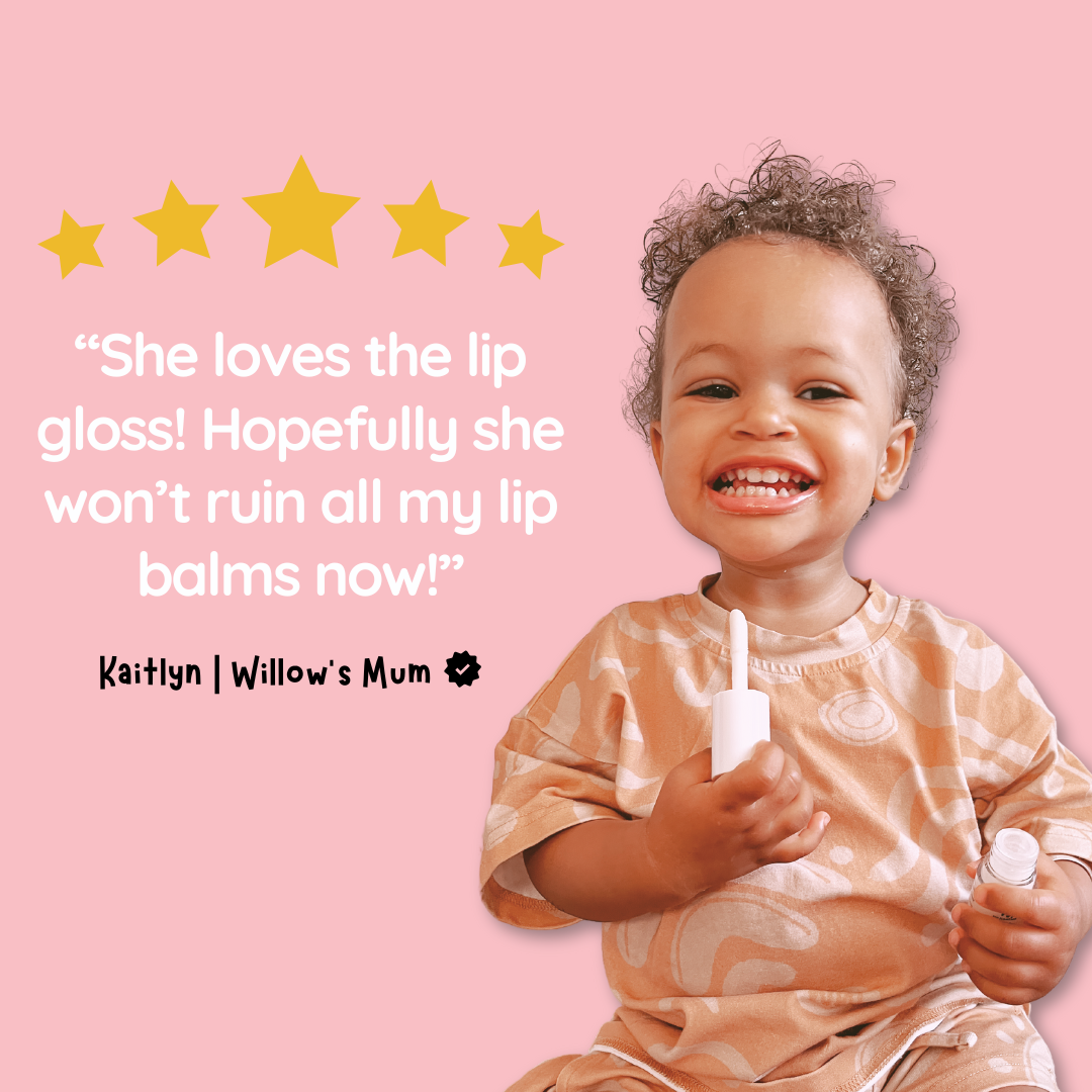 Child holding lip gloss with five-star rating and review on pink background