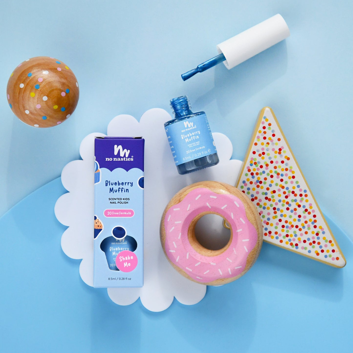 No Nasties products including a bottle, packaging, and cookies on a blue background