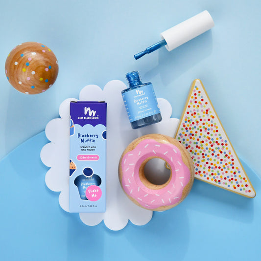 No Nasties products including a bottle, packaging, and cookies on a blue background