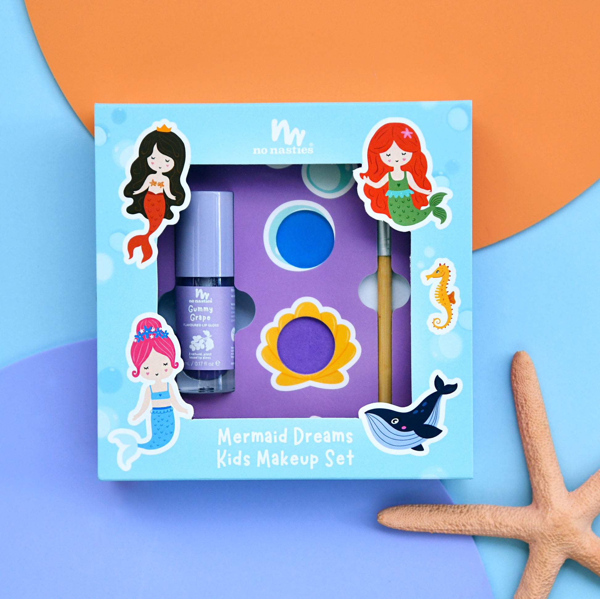 Mermaid-themed kids makeup set with packaging on a colorful background