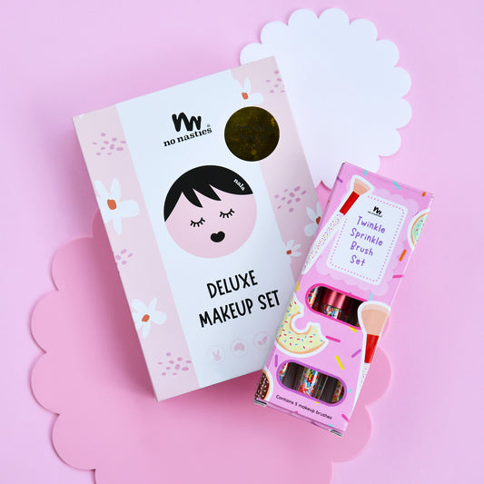 Children's makeup set with packaging on a pink background