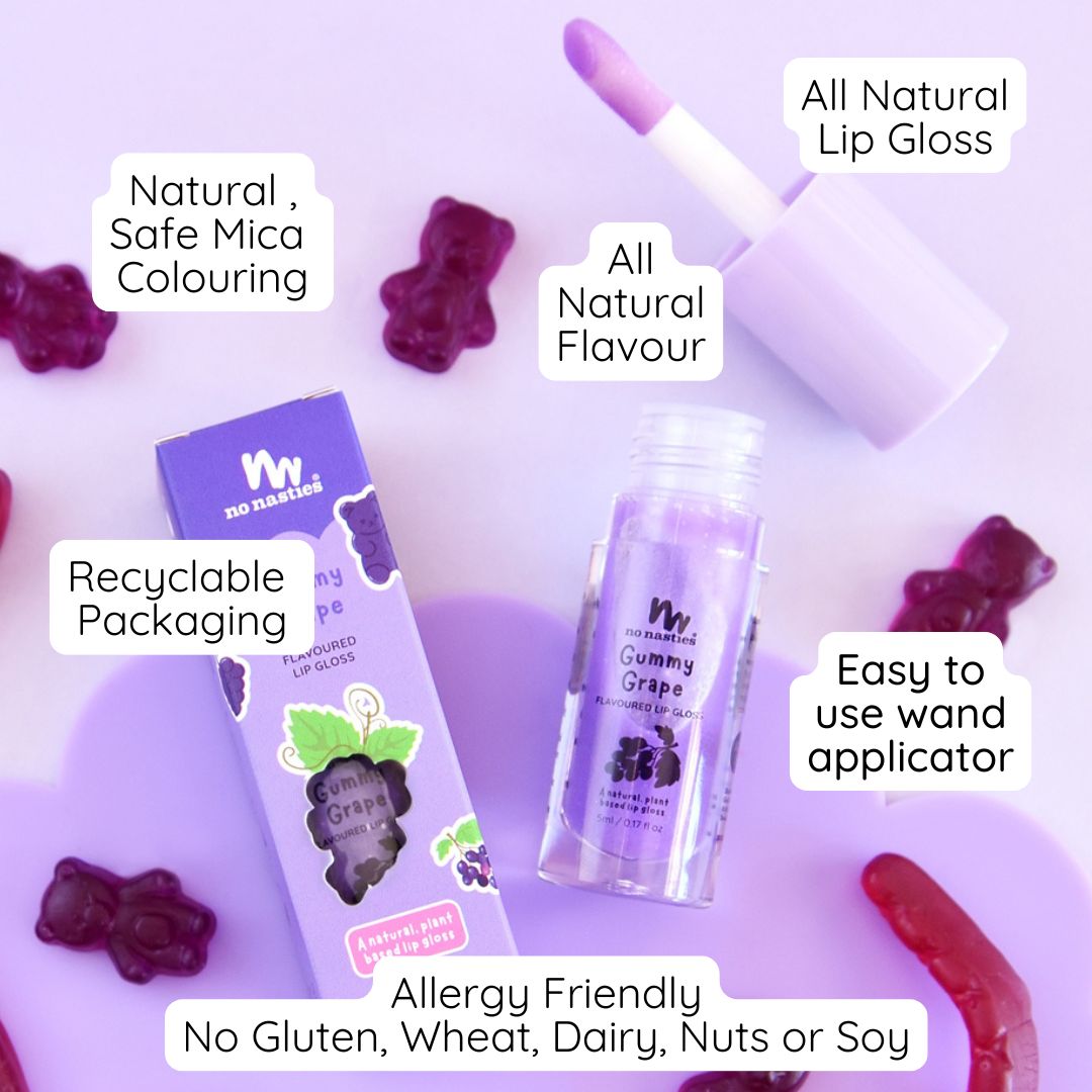 All natural lip gloss with packaging and gummy bears on a light purple background