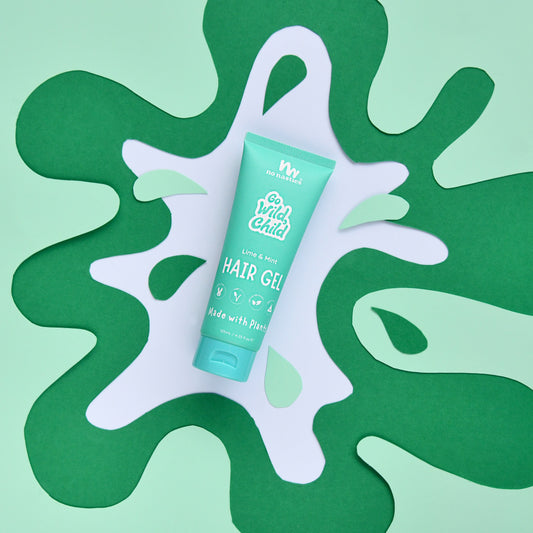 Green hair gel tube on a green and white abstract background