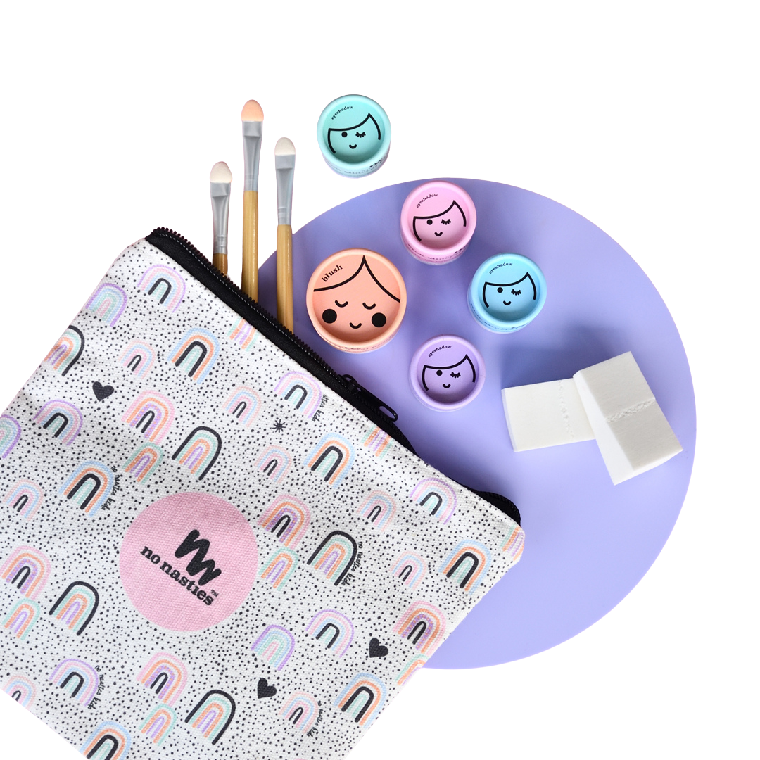 Makeup tools including brushes, a palette, and a pouch with a brand logo on a white background.