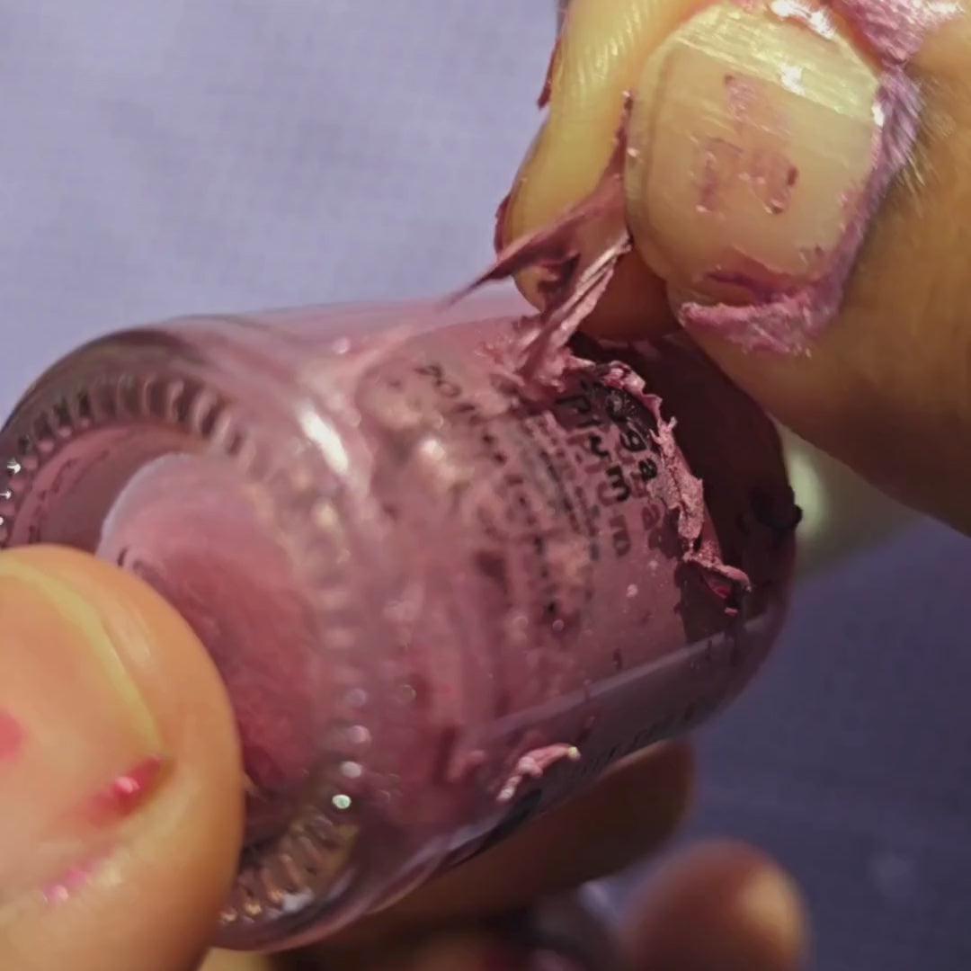 Bright Pink kids nail polish peeling cleanly off a bottle without remover