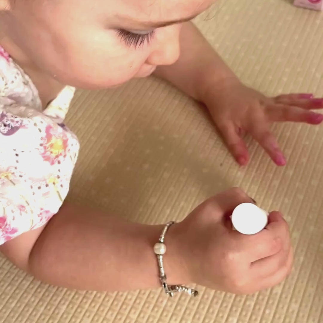 Bright Pink kids nail polish painted on little nails