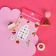Sticker sheet with strawberry cupcake design on a pink background