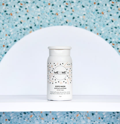 White skincare product bottle with a patterned label on a textured blue background