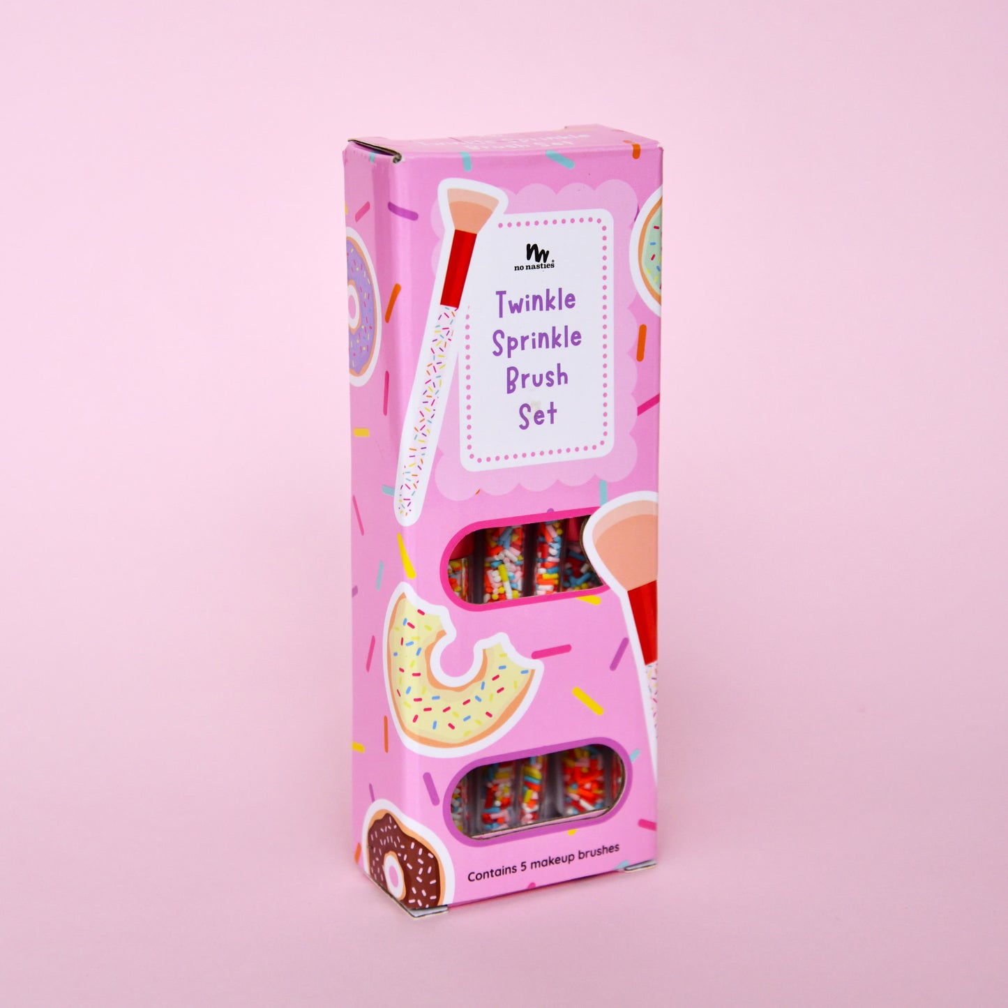 Pink packaging of a 'Twinkle Sprinkle Brush Set' on a pink background