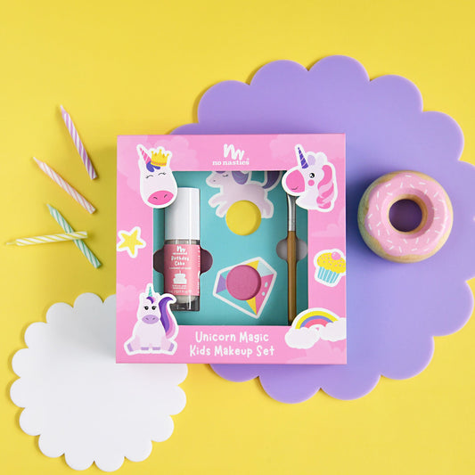 Unicorn-themed kids makeup set with a pink box on a yellow background