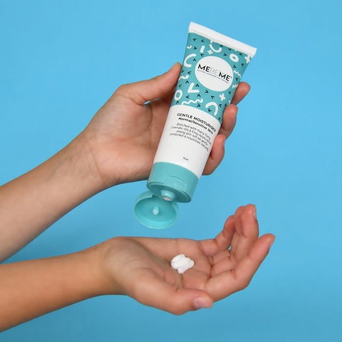 blue-and-white-moisturiser-tube-cream-into-palm-of-hand