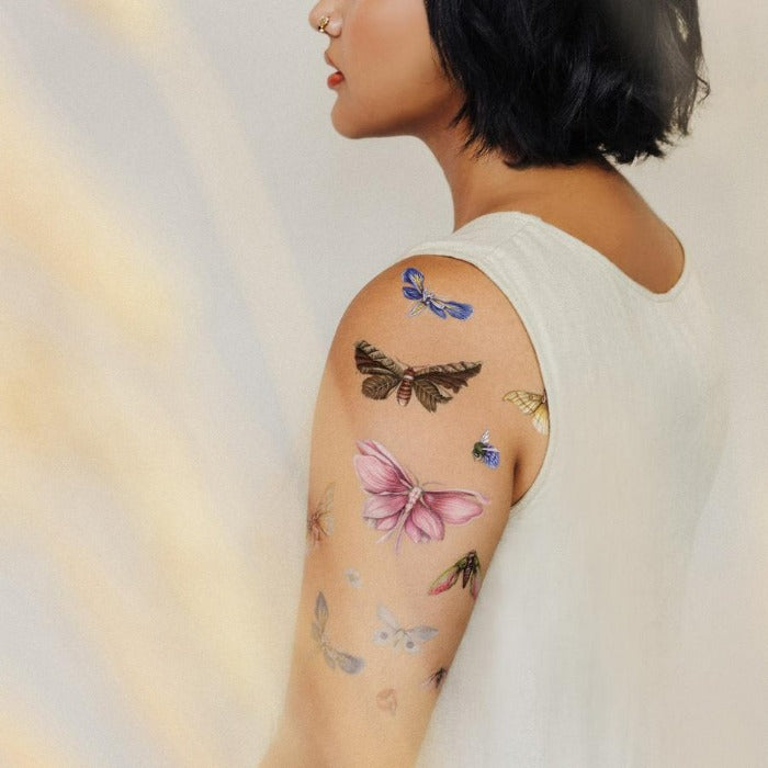 Moth-tattoos-on-womans-arm